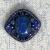 Брошь выдержана строго в синей гамме, натуральный камень обшит японским бисером, кристаллами