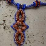 Сине-бежевый кулон с бусинами на плетеном шнуре